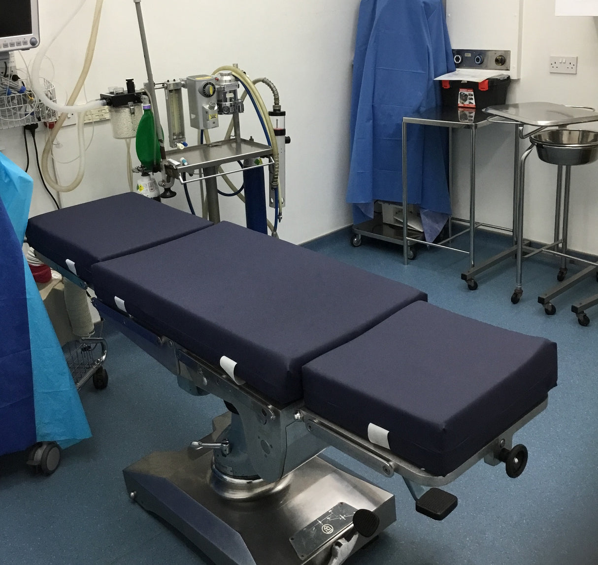 Three part mattress on an Eschmann MR surgery table - Navy cover & retention straps